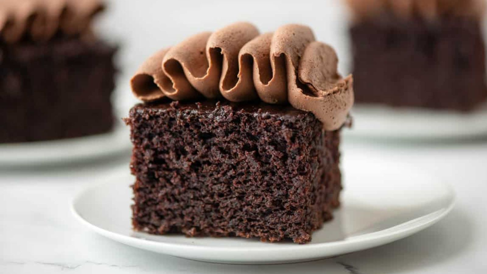 A slice of chocolate cake on a plate.