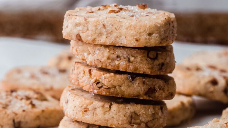 Stack of shortbread cookies with pecans.