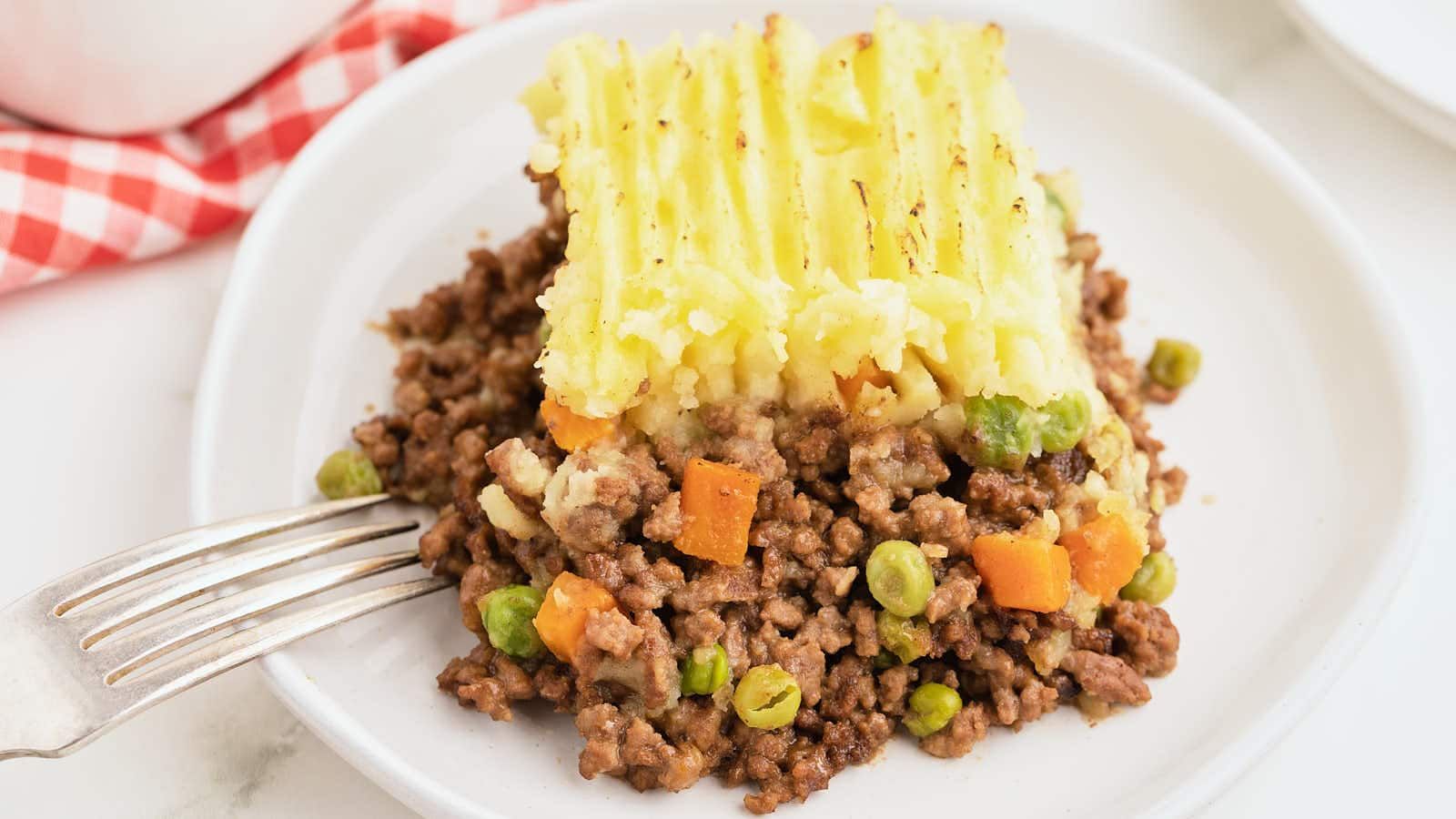 A slice of shepherd's pie on a plate.