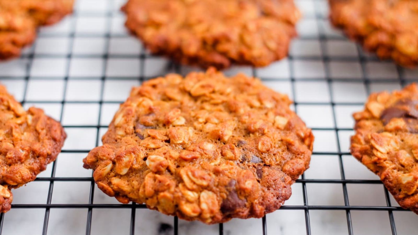 Oatmeal cookies on a drying rack.