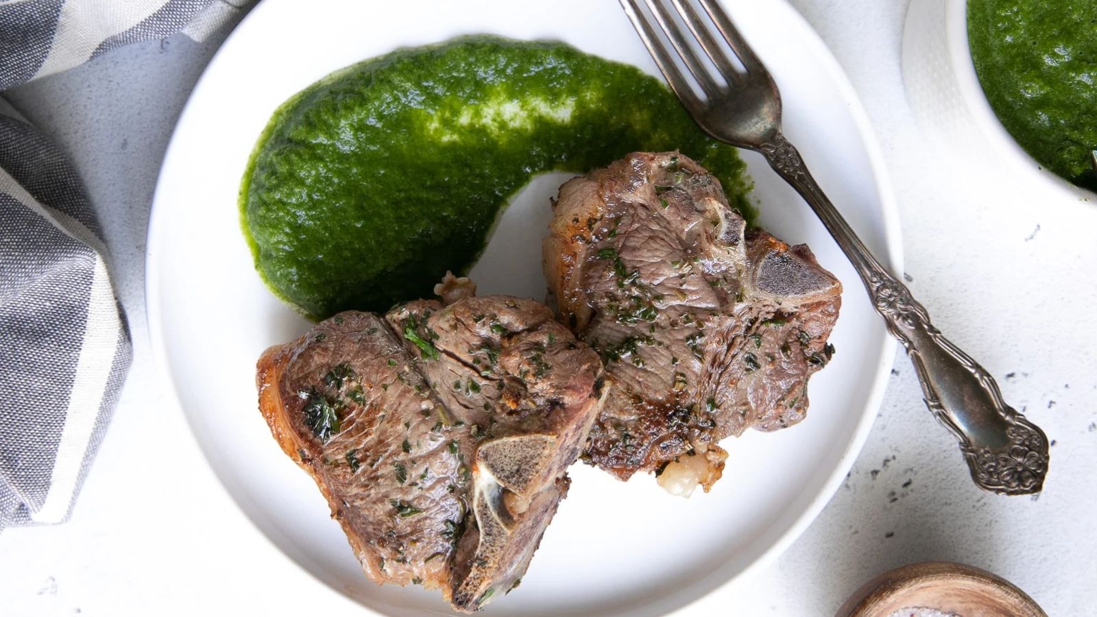 Lamb chops on a plate.