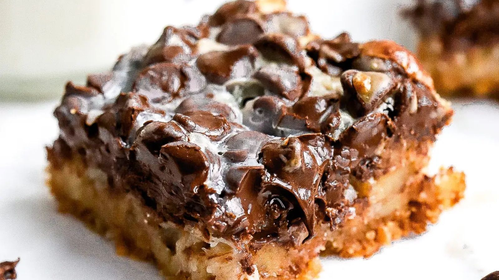 A slice of magic bar on a plate.