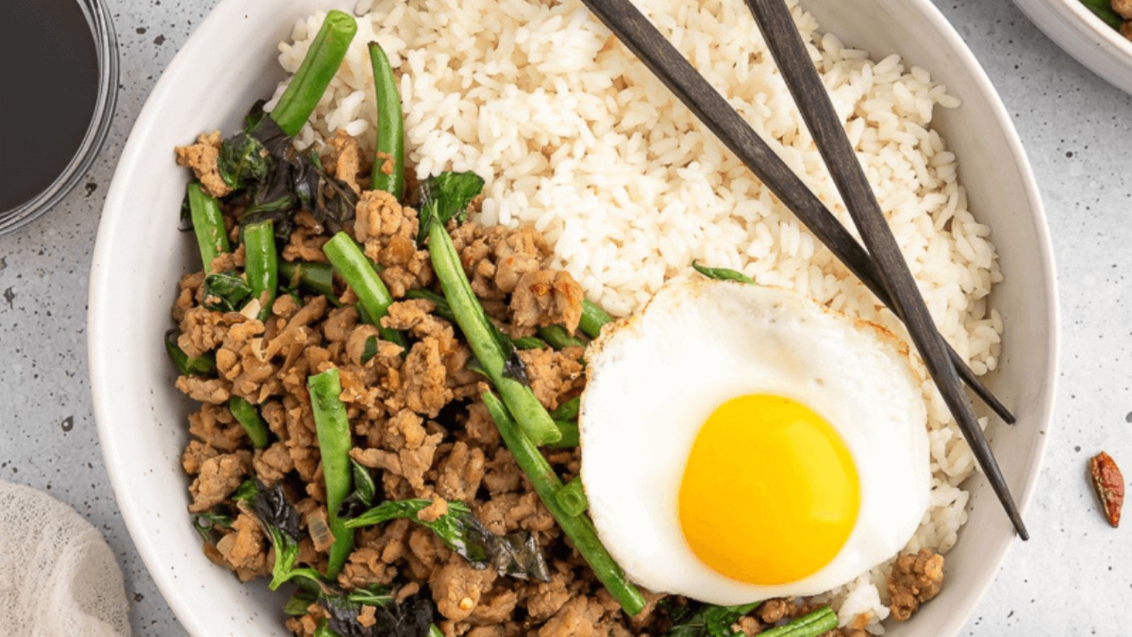 Ground pork with rice and sunny side up egg.