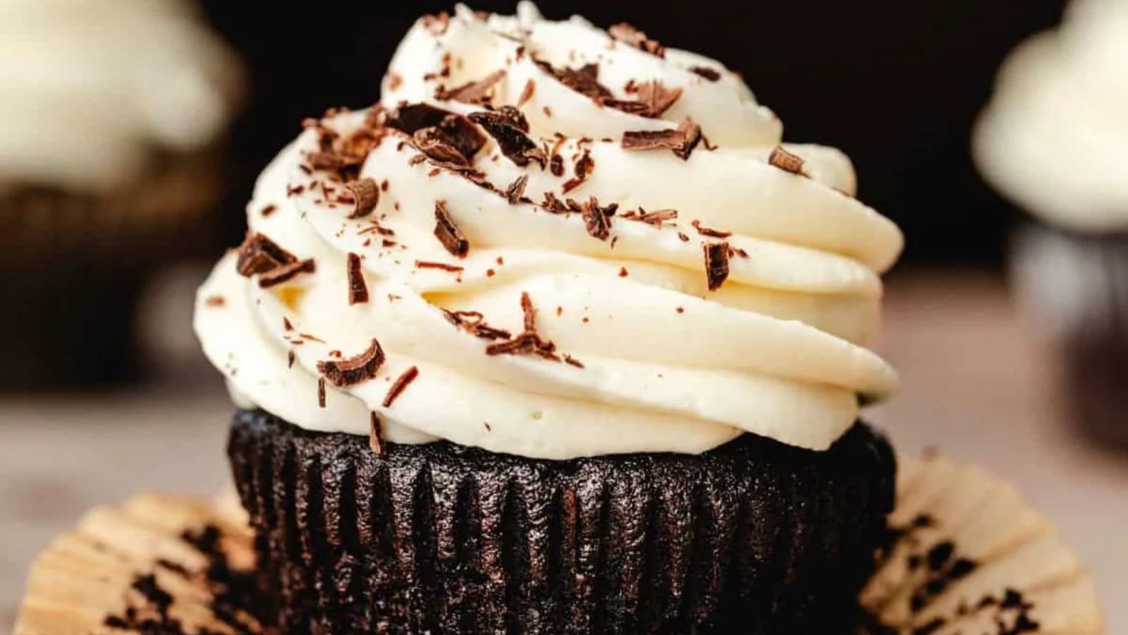 Chocolate cupcake with frosting on top.