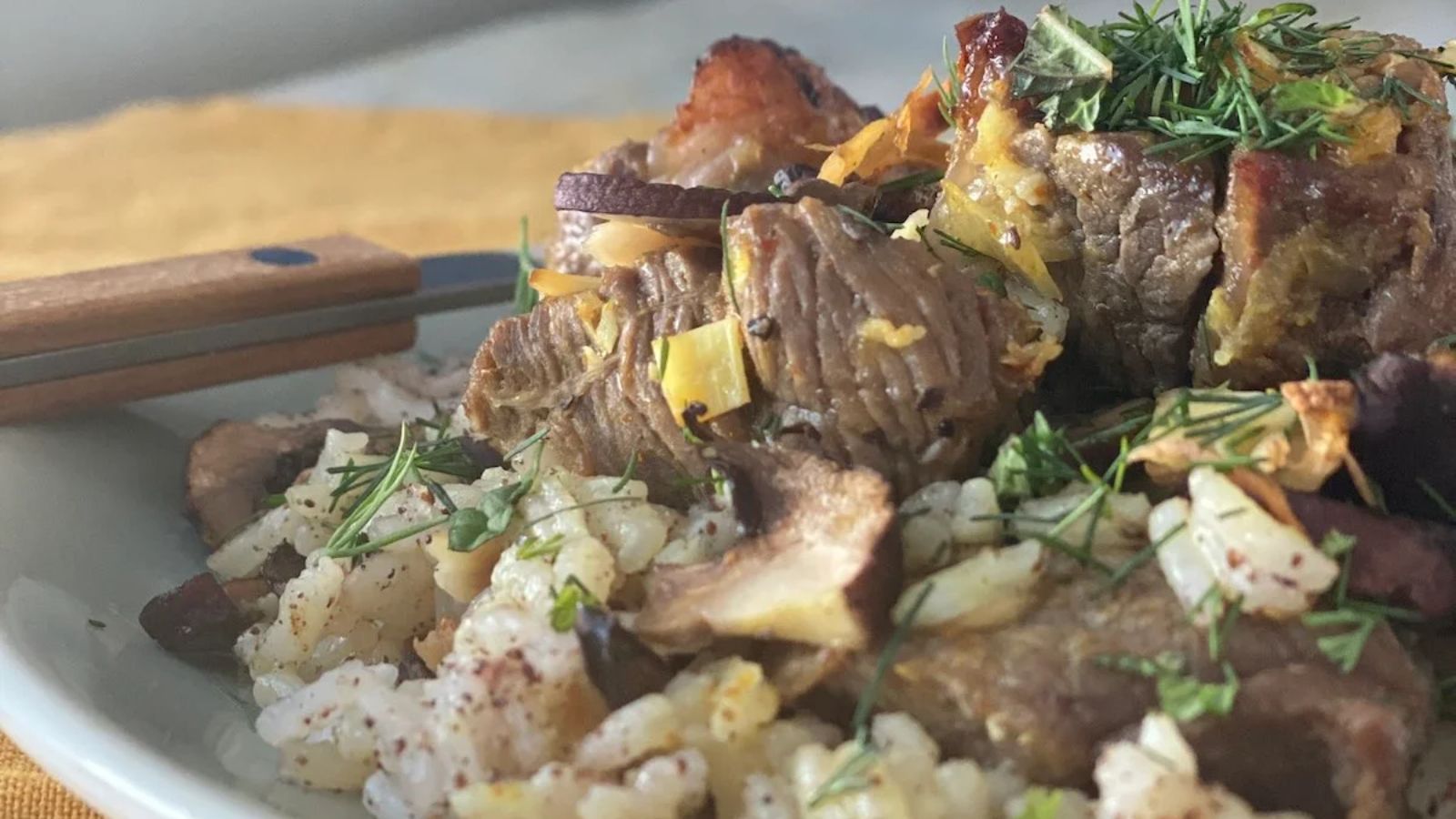 Lamb kebabs on a plate.