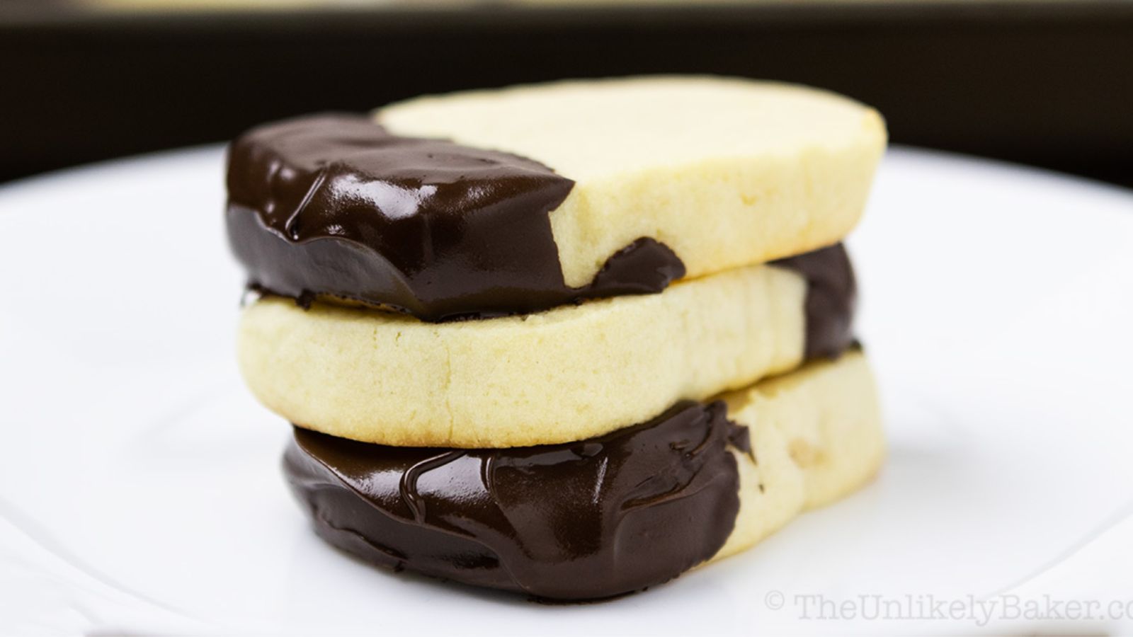 Stack of mascaporne cookies on a plate.