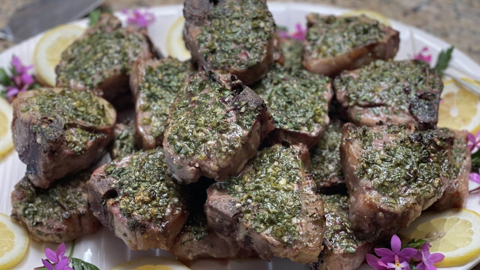 Lamb chops on a plate.
