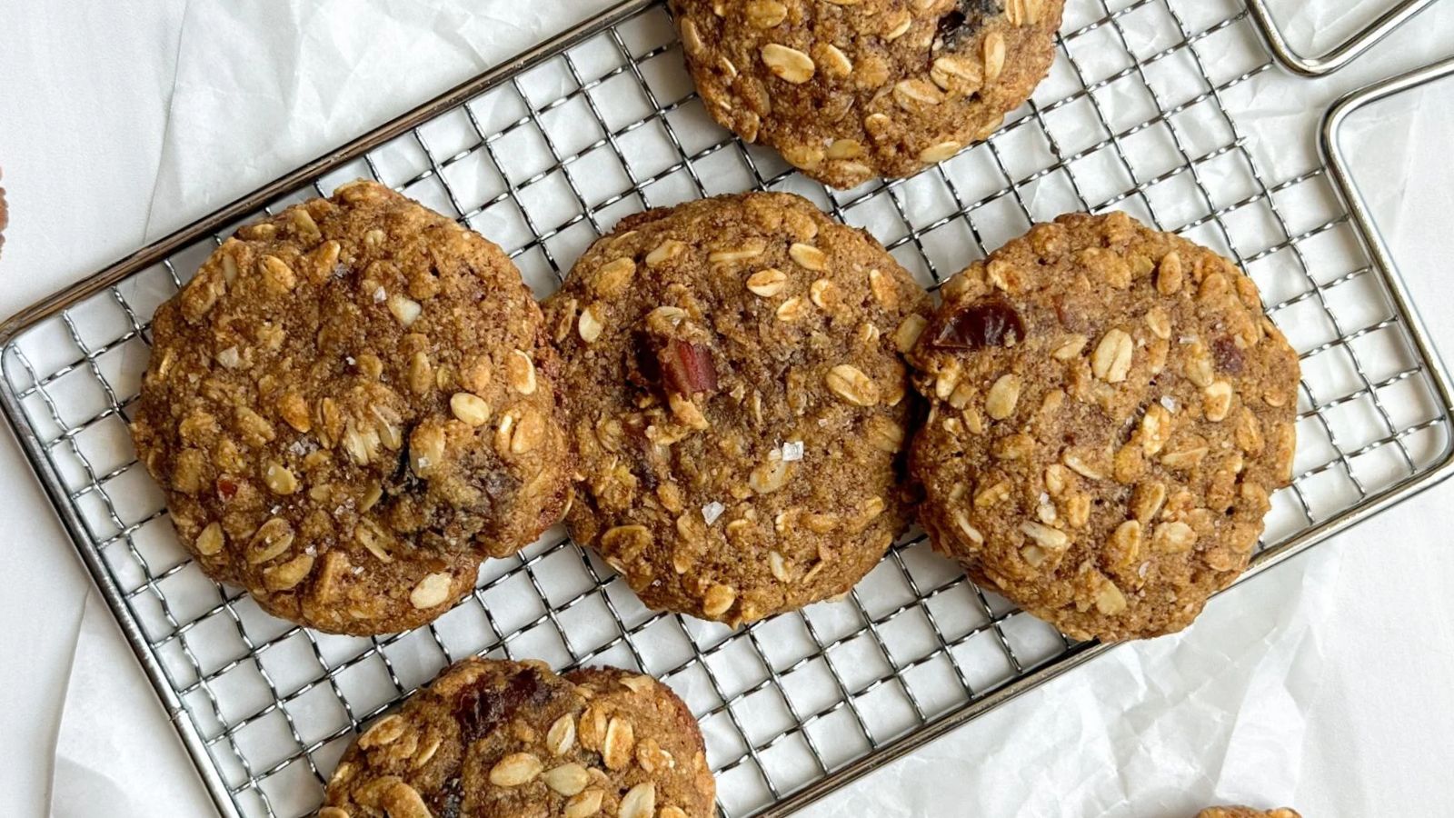 Oatmeal cookies on a drying rack.