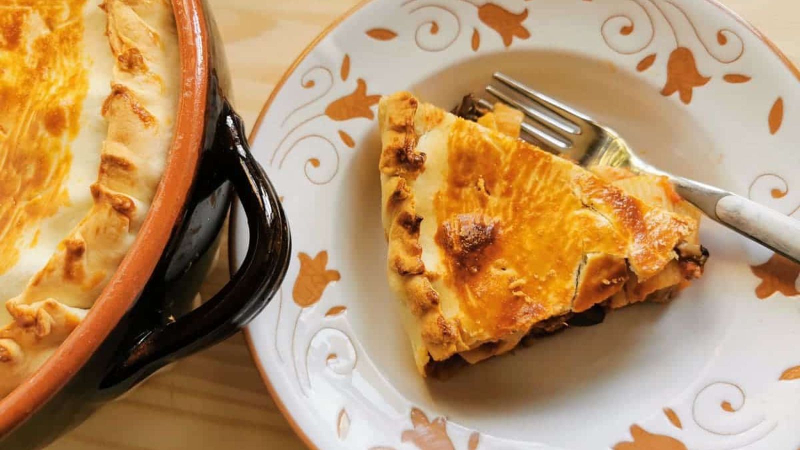 A slice of pasta pie on a plate.