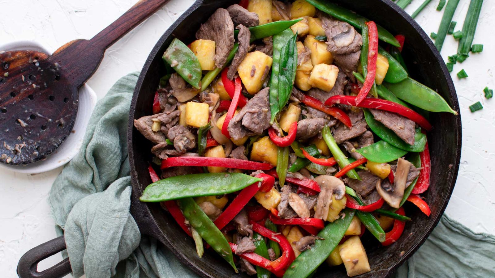 Beef stir fry in a pan.