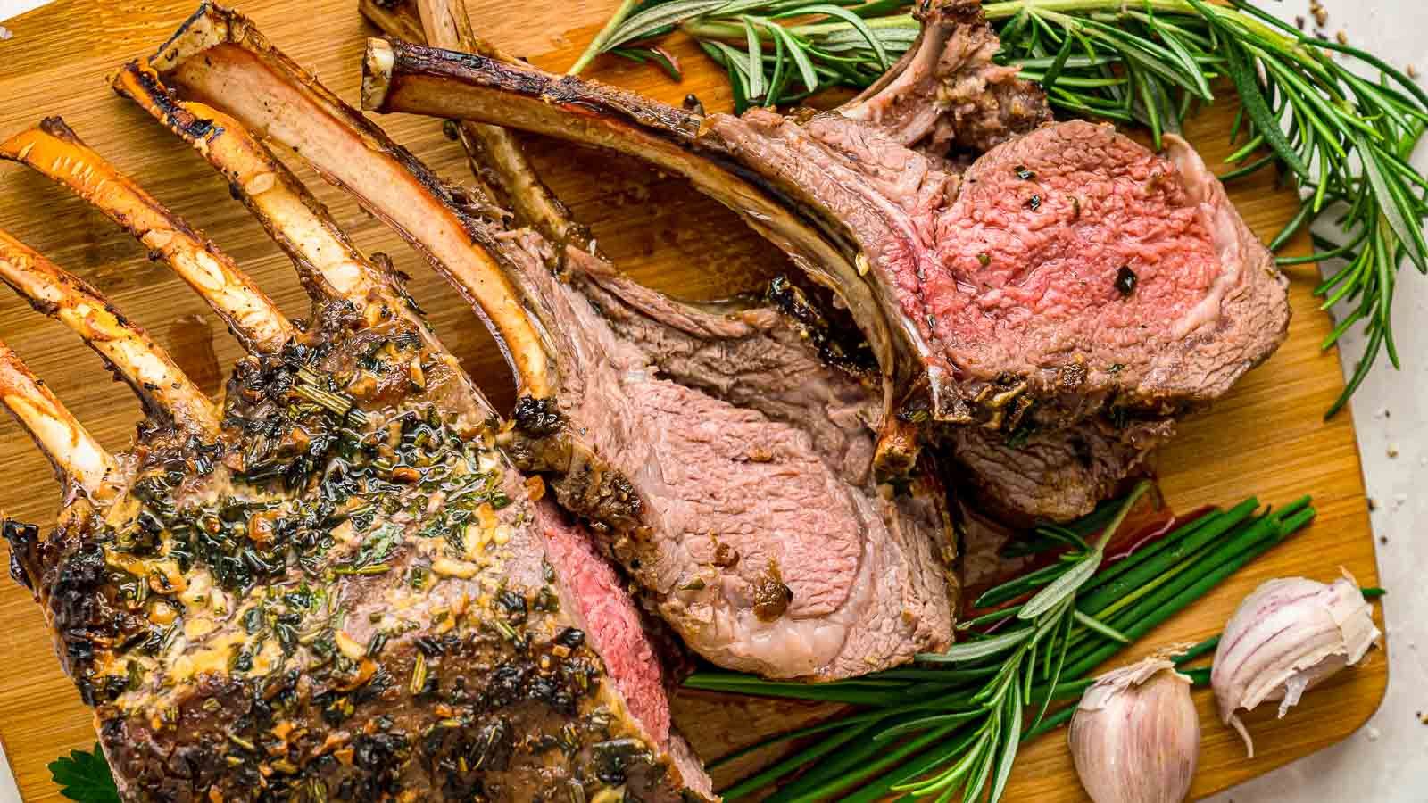 Rack of lamb on a wooden board.
