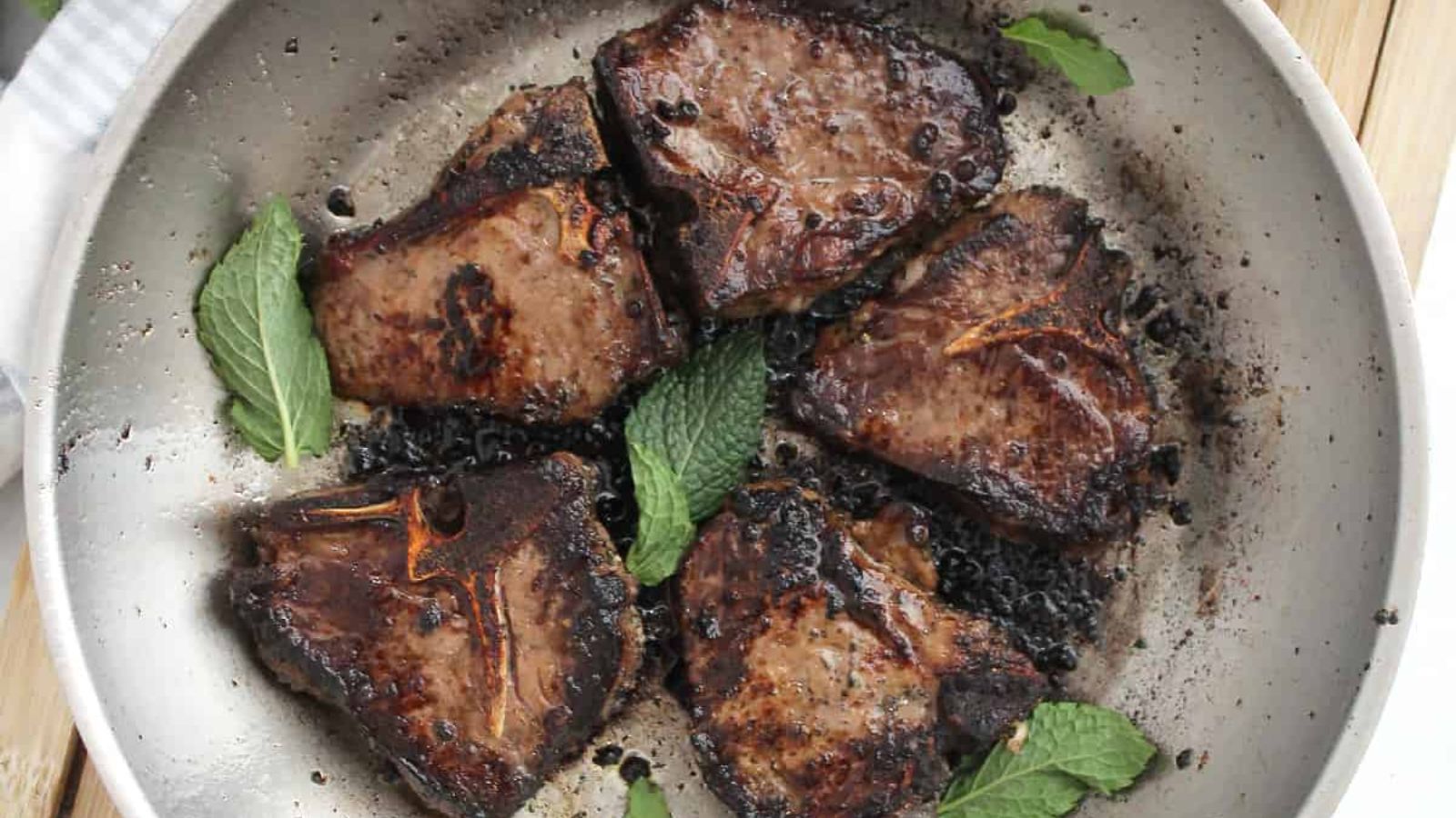 Lamb chops on a plate.