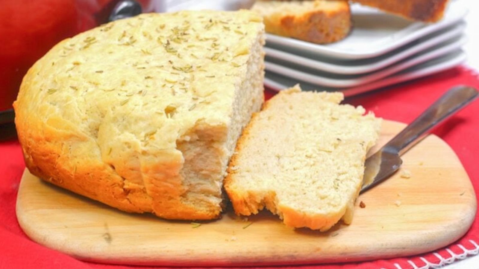 Sliced bread on a wooden board.