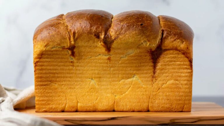 Whole loaf on a wooden board.