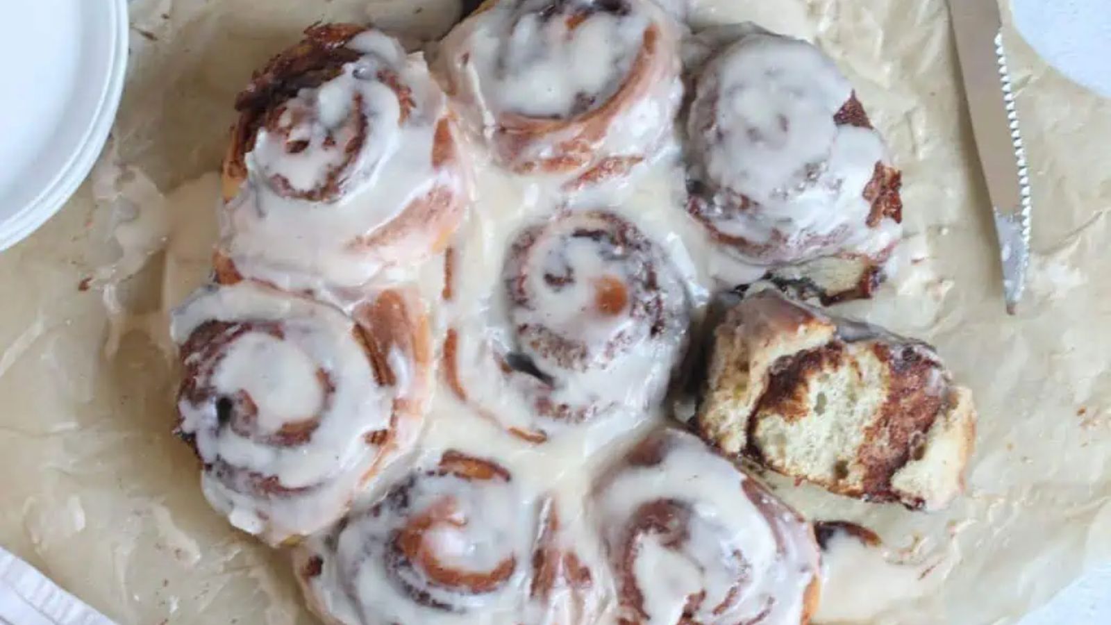 Cinnamon rolls on a parchment paper.