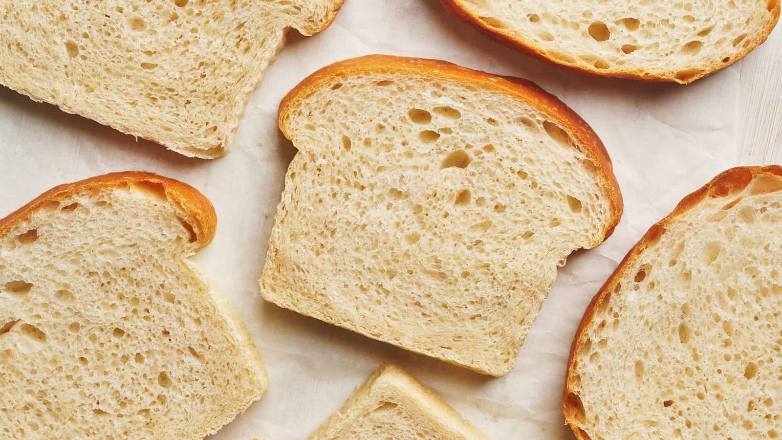 Bread slices on a white surface.