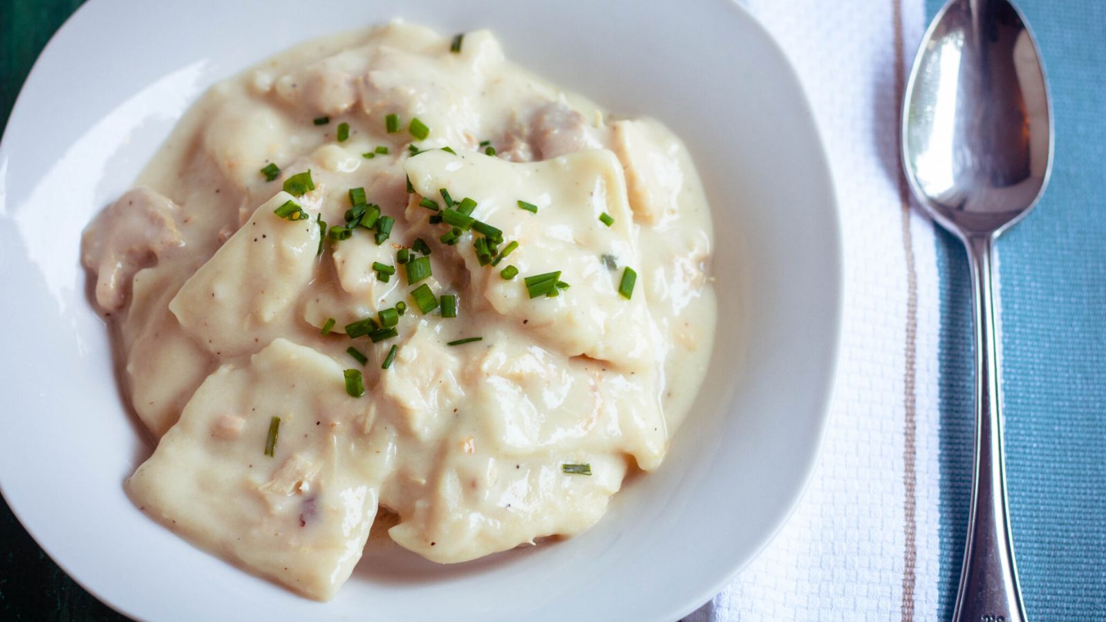 Chicken and dumplings on a plate.