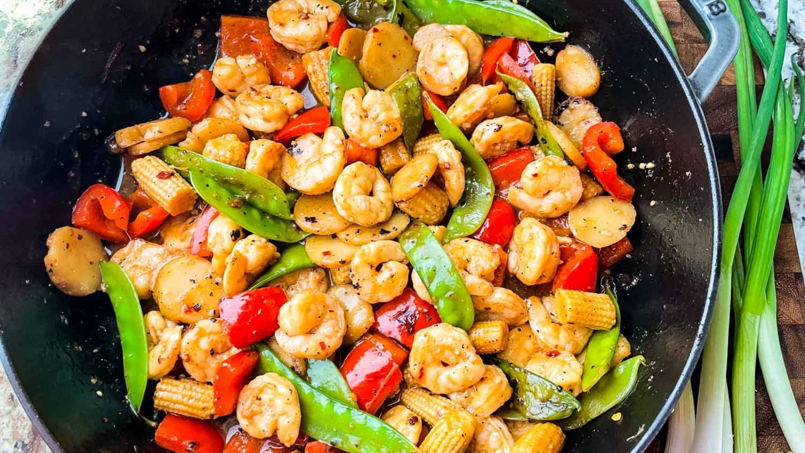 Sweet and sour shrimp in a pan.