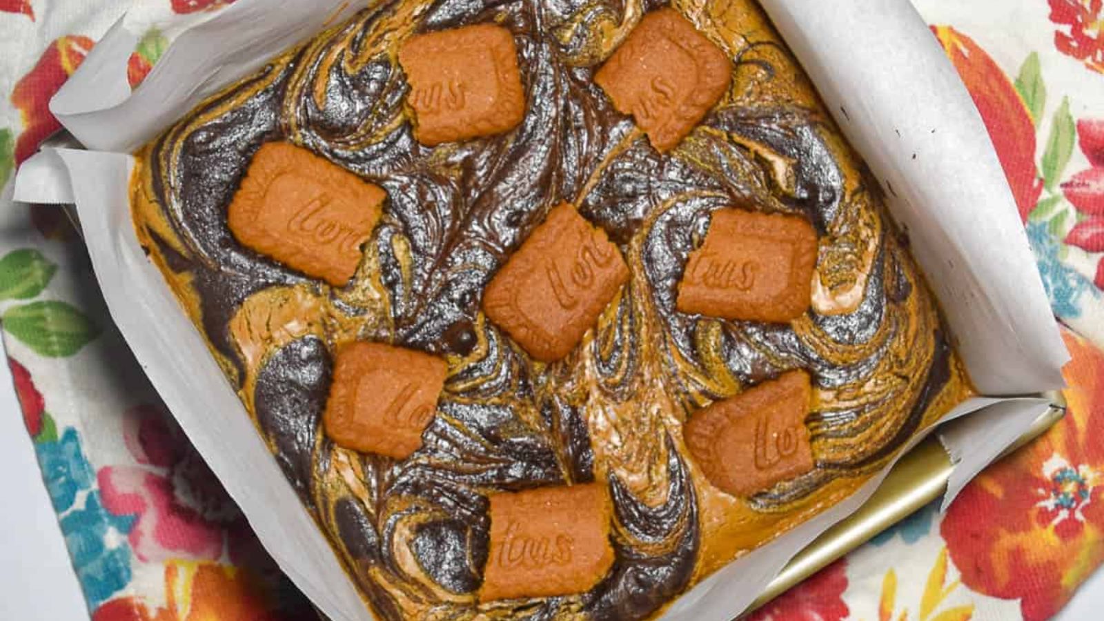 Brownies with biscoff biscuits on top.