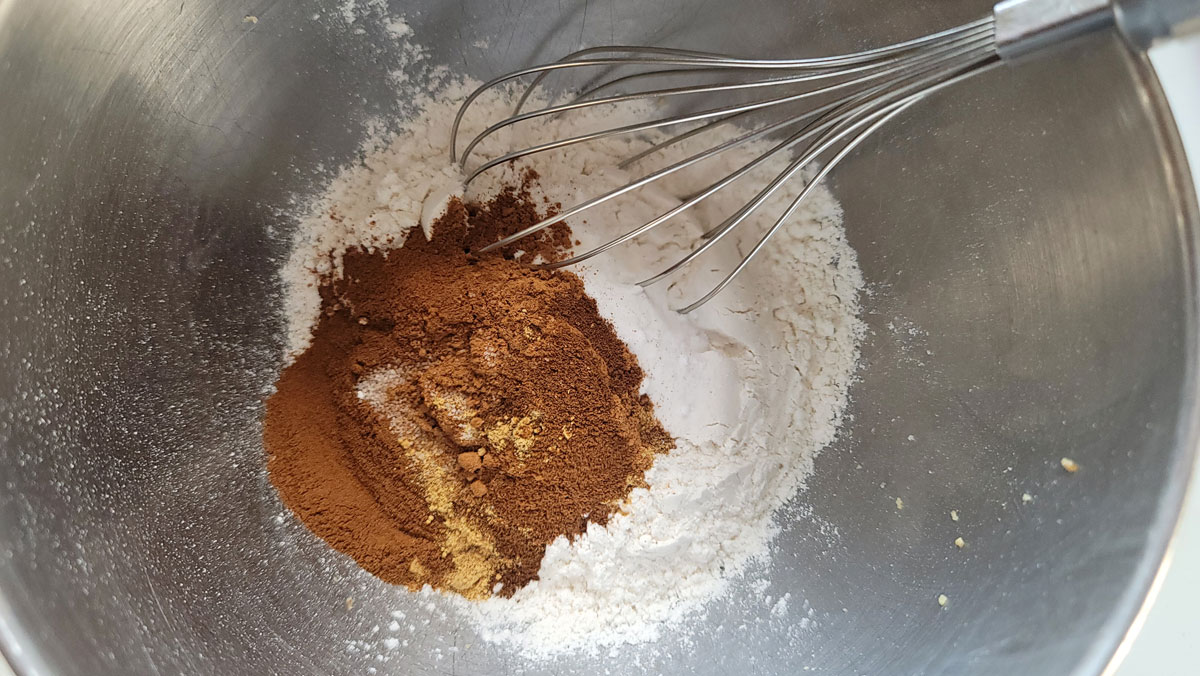 Dry ingredients add to a large bowl.
