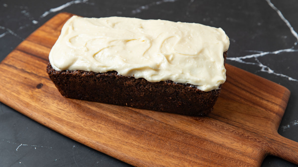 Whole loaf cake on a wooden board.