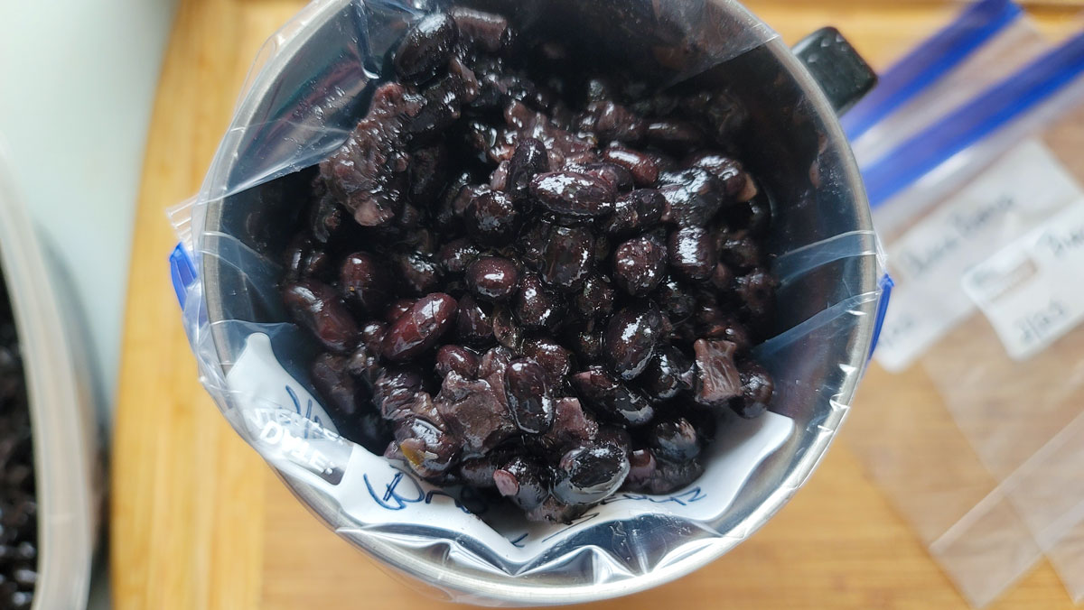 Beans scooped into a freezer bag.