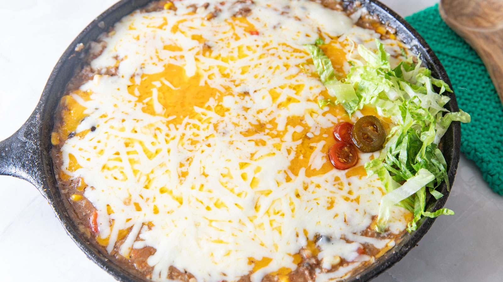 Beef and rice with melted cheese.
