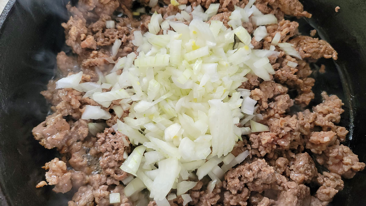 Onion on top of browned meat.