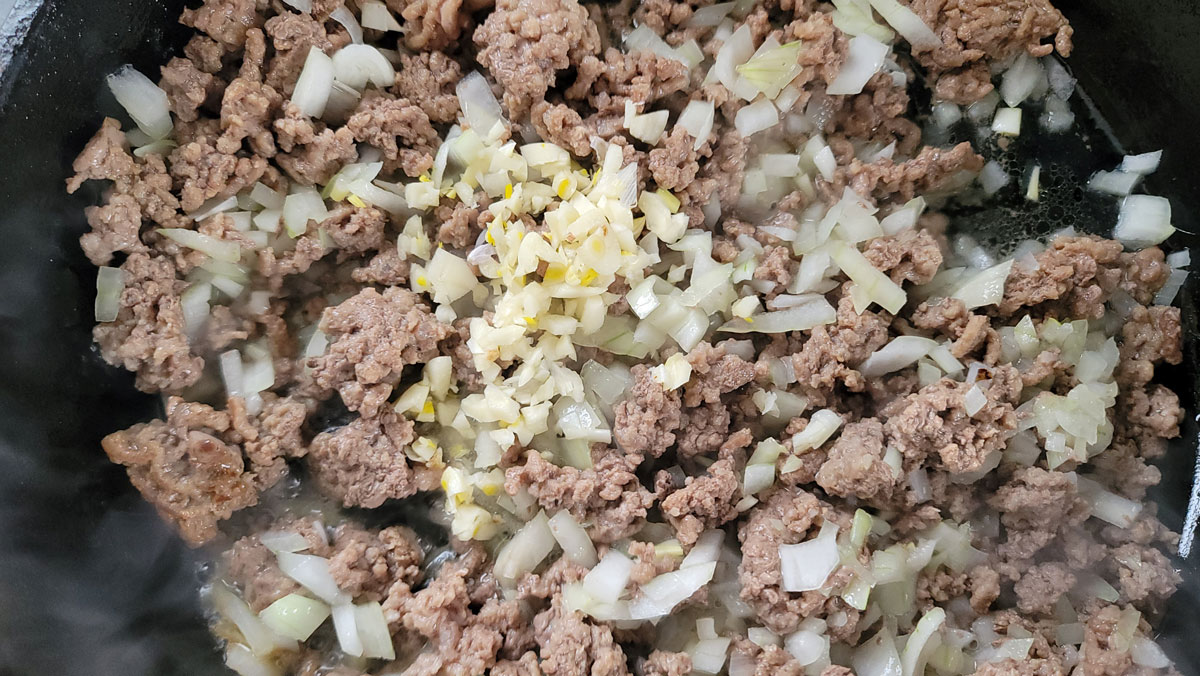 Garlic added to the meat and onions.