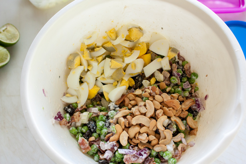Dressing mixed into the salad and chopped hard boiled eggs added.