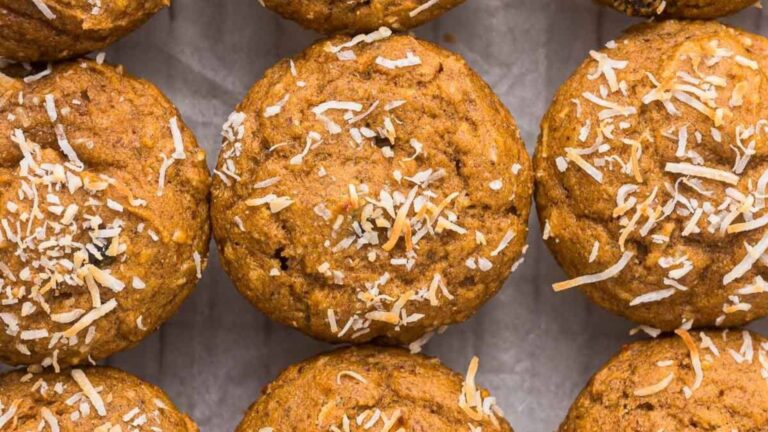 Coconut topped muffins in a tin.