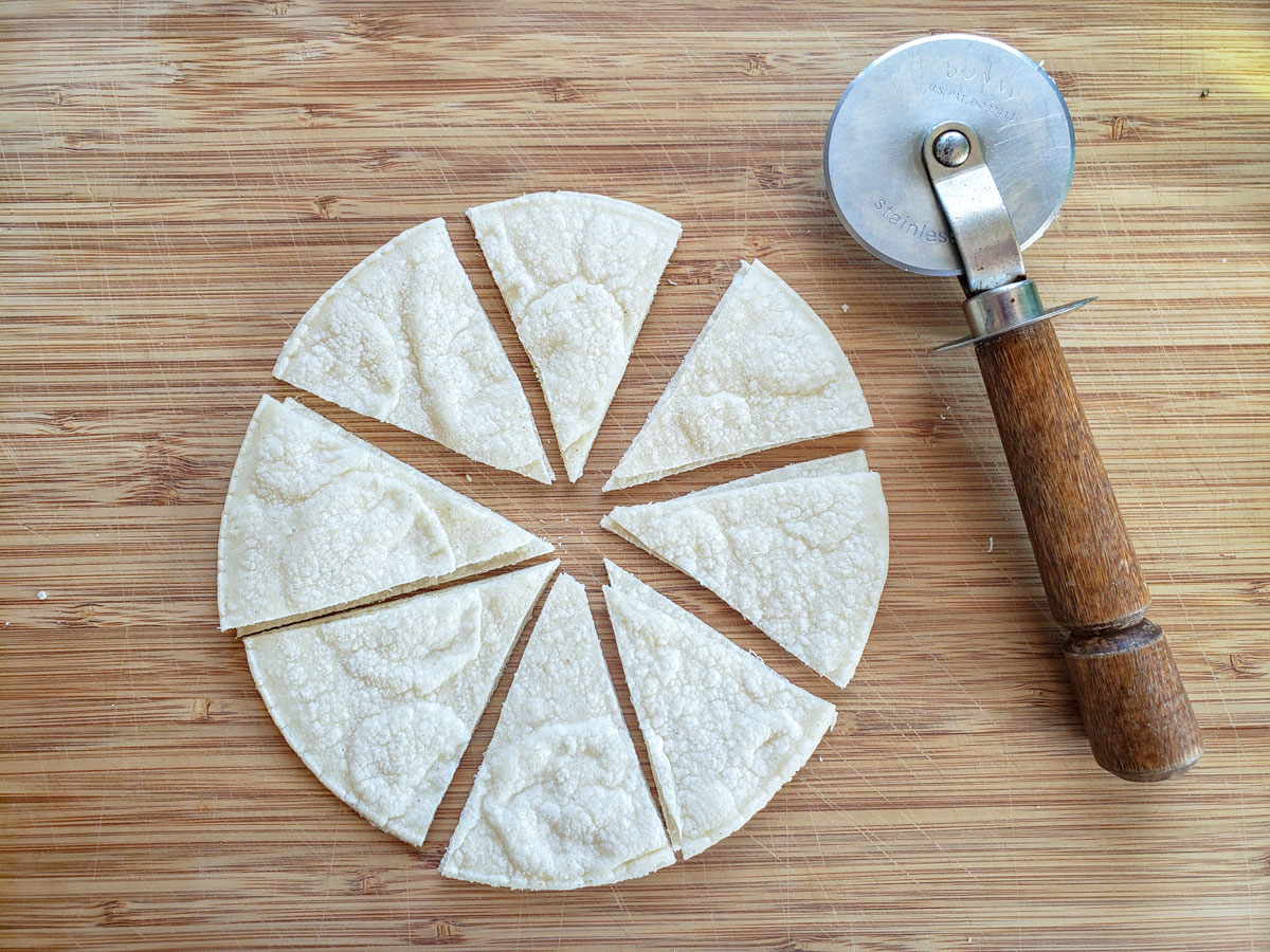 Corn tortilla cut into 8 triangles.