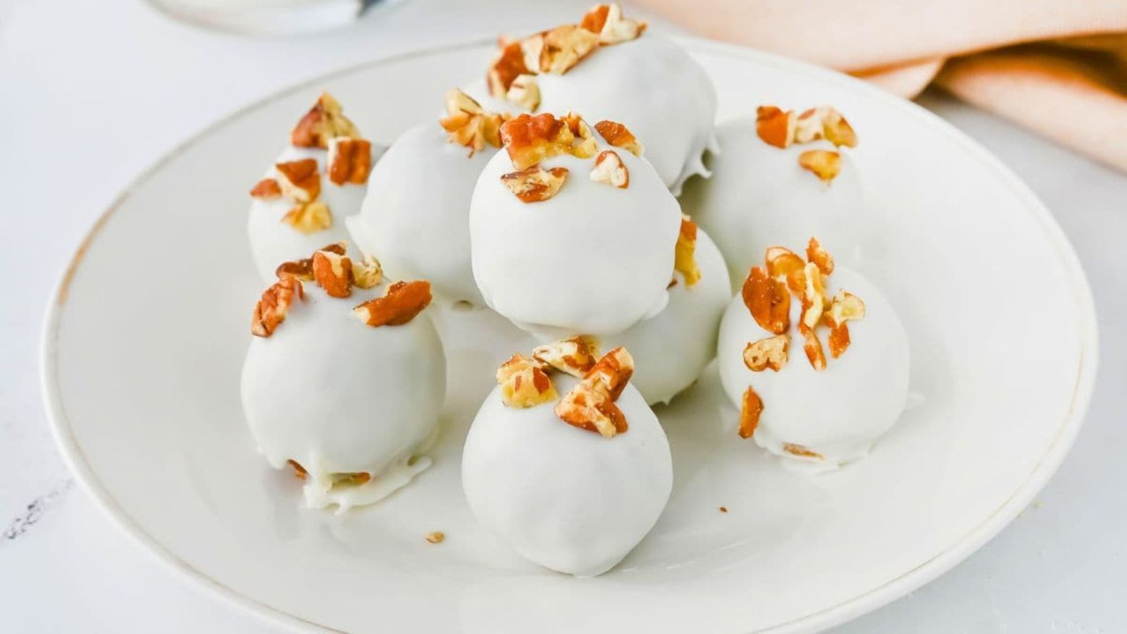 Carrot truffles on a plate.