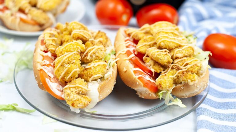 Shrimp po boy sandwich on a plate.