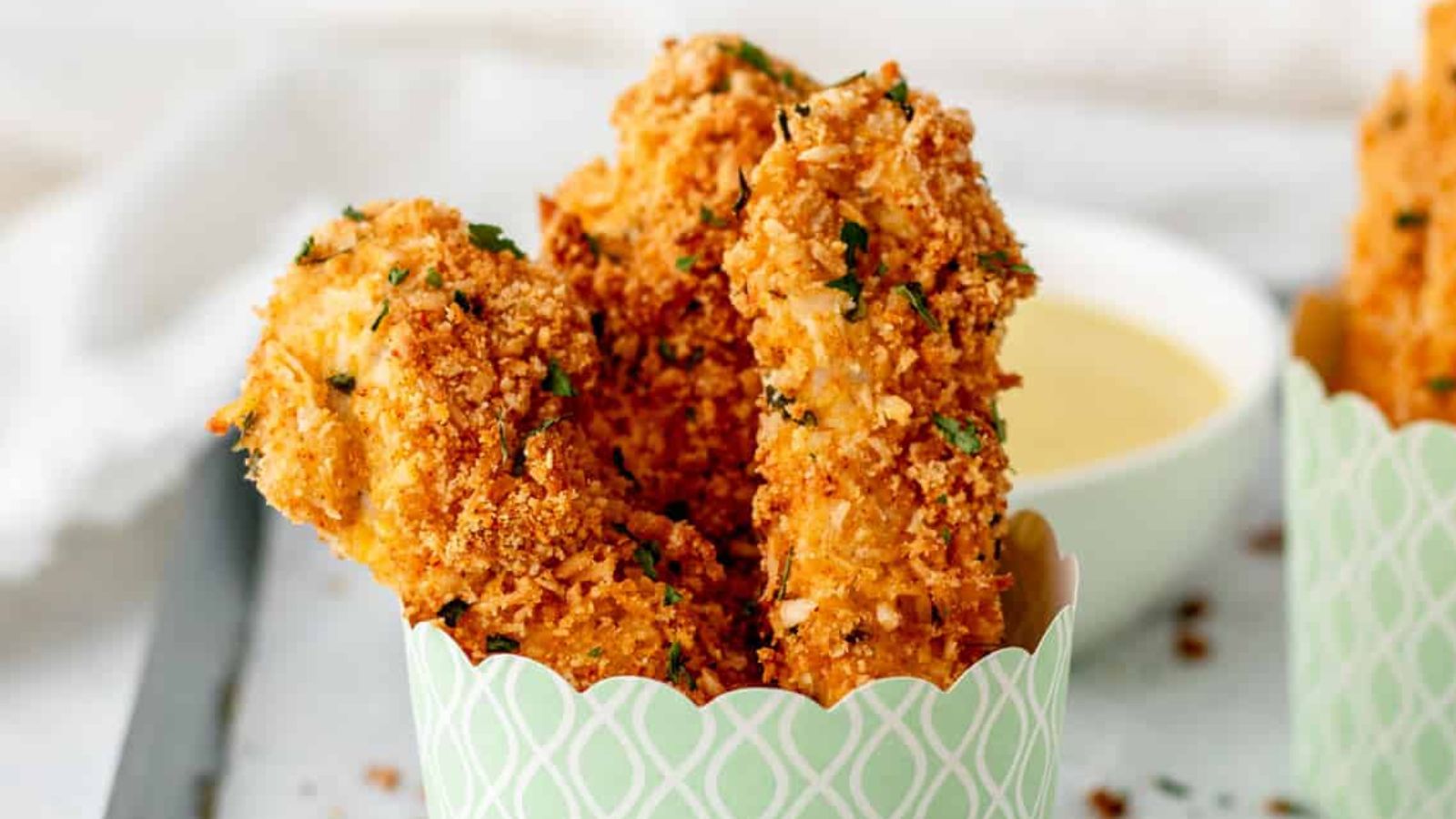Chicken tenders in a cup.