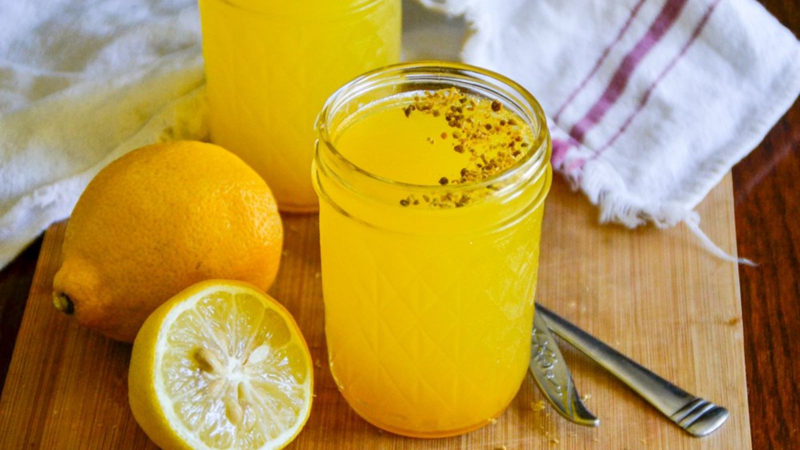 Lemon jello cups with ginger turmeric in a glass.