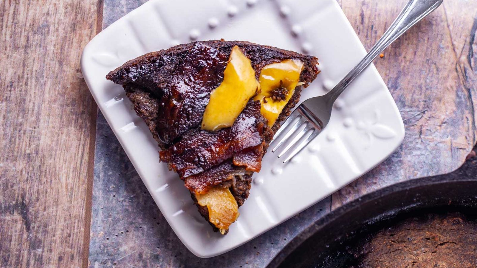 A slice of apple pancake on a plate.