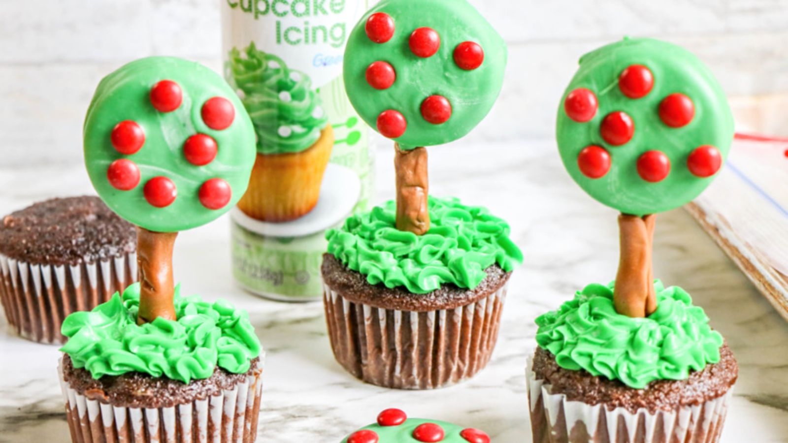 Apple tree cupcakes on a white background.