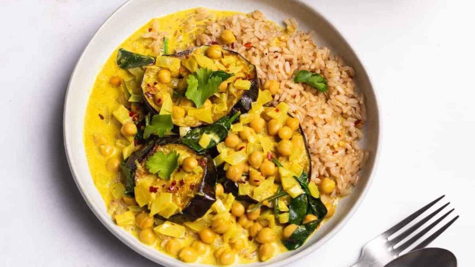 Aubergrine curry in a bowl.