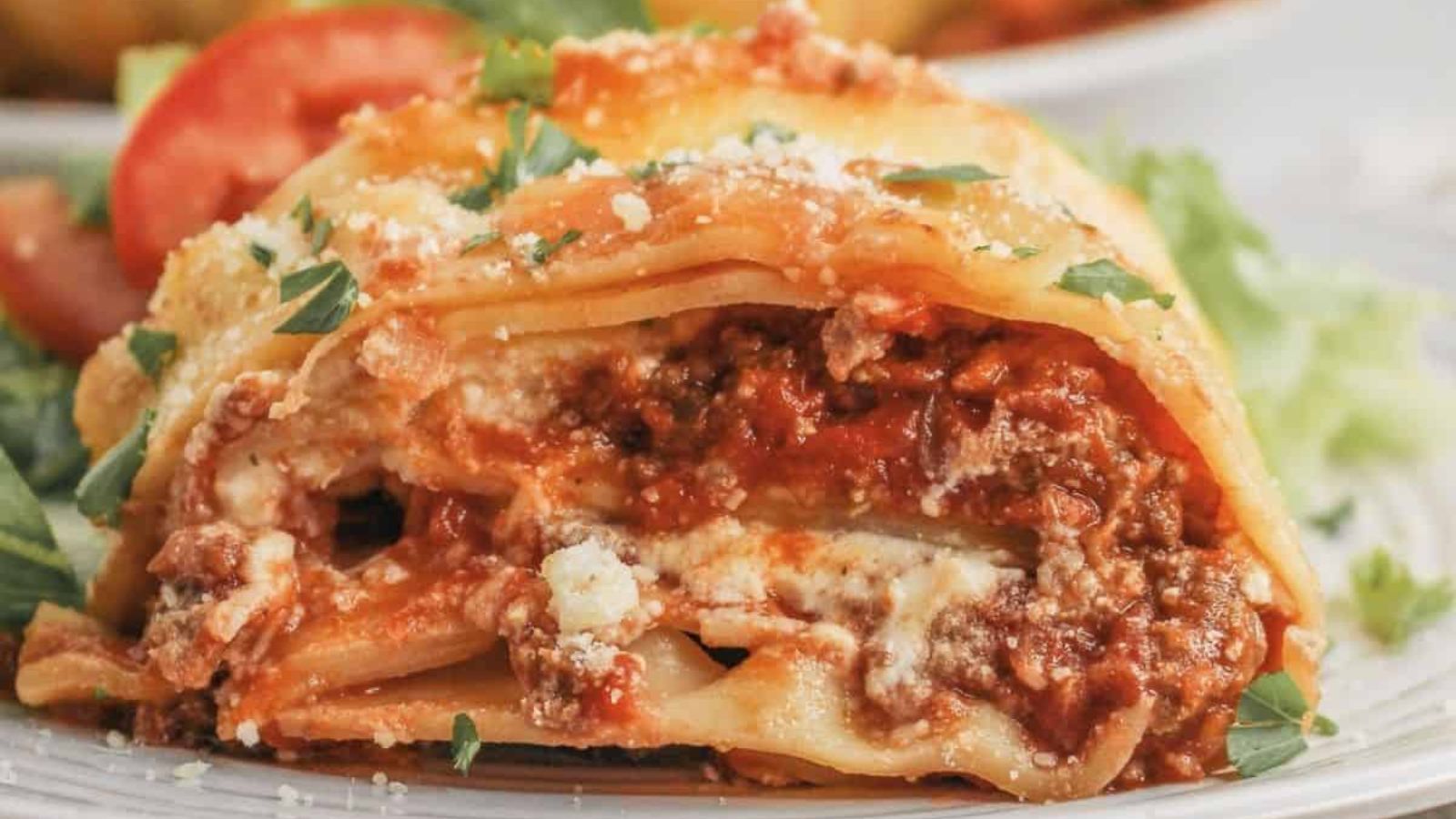 A portion of bundt lasagna on a plate.