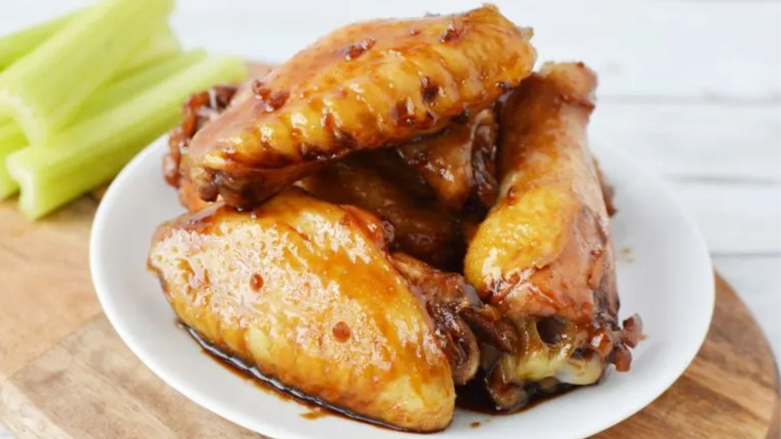 Teriyaki chicken wings on a plate.