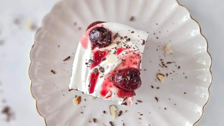 A slice of black forest cake on a plate.
