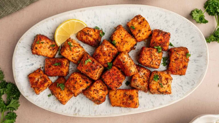 Salmon bites on a plate.
