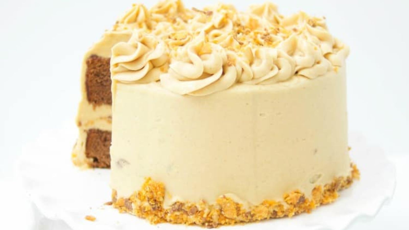 Butterfinger cake with slice.