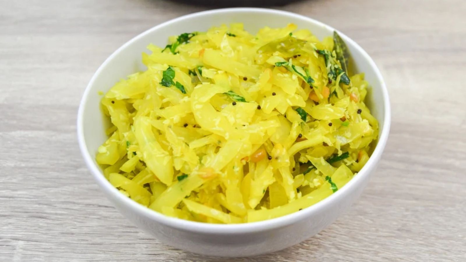 Cabbage poriyal in a bowl.