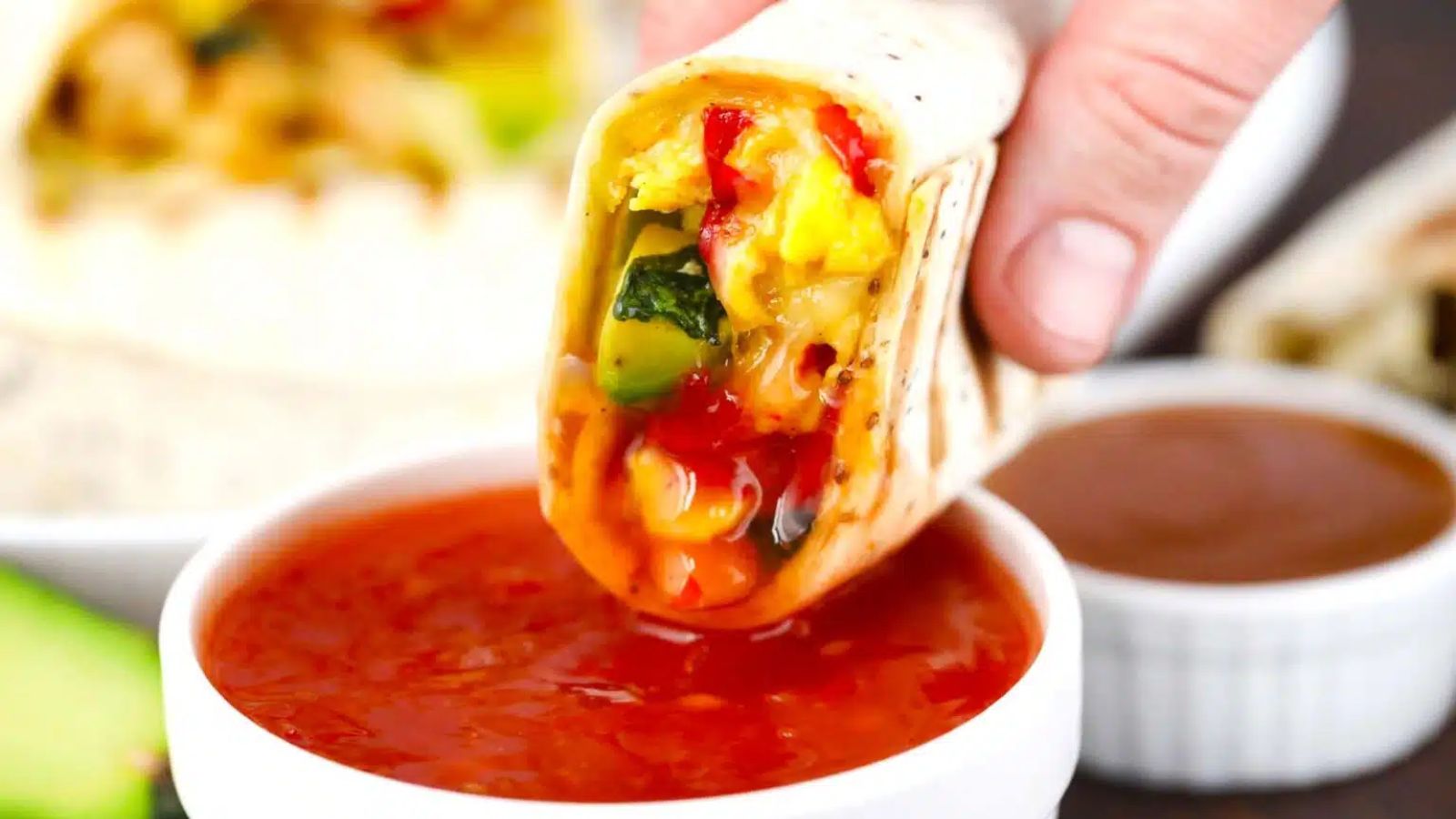 Burrito and dip close up shot.