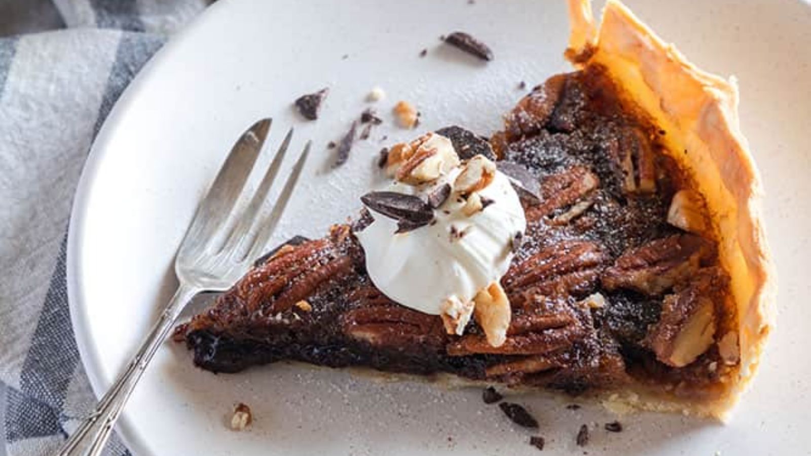 A slice of pecan pie on a plate.