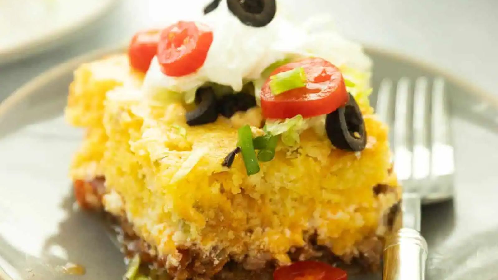 A slice of cornbread taco bake on a plate.