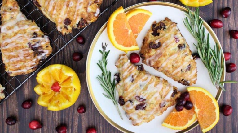Cranberry orange scones on a plate.