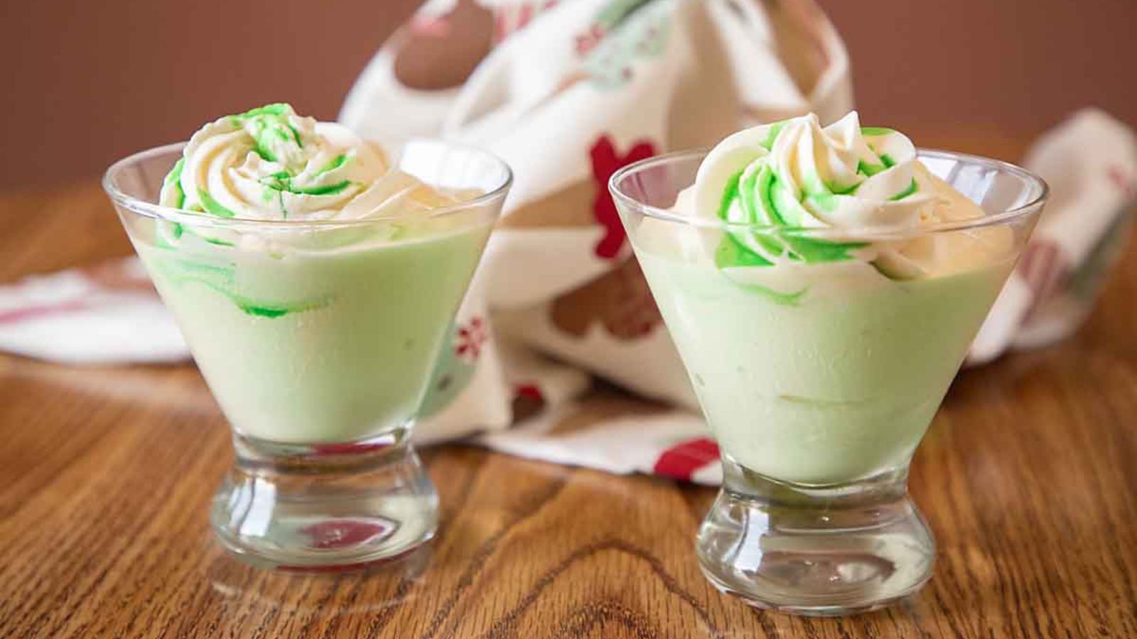 Two glasses of grasshopper ice cream drink.
